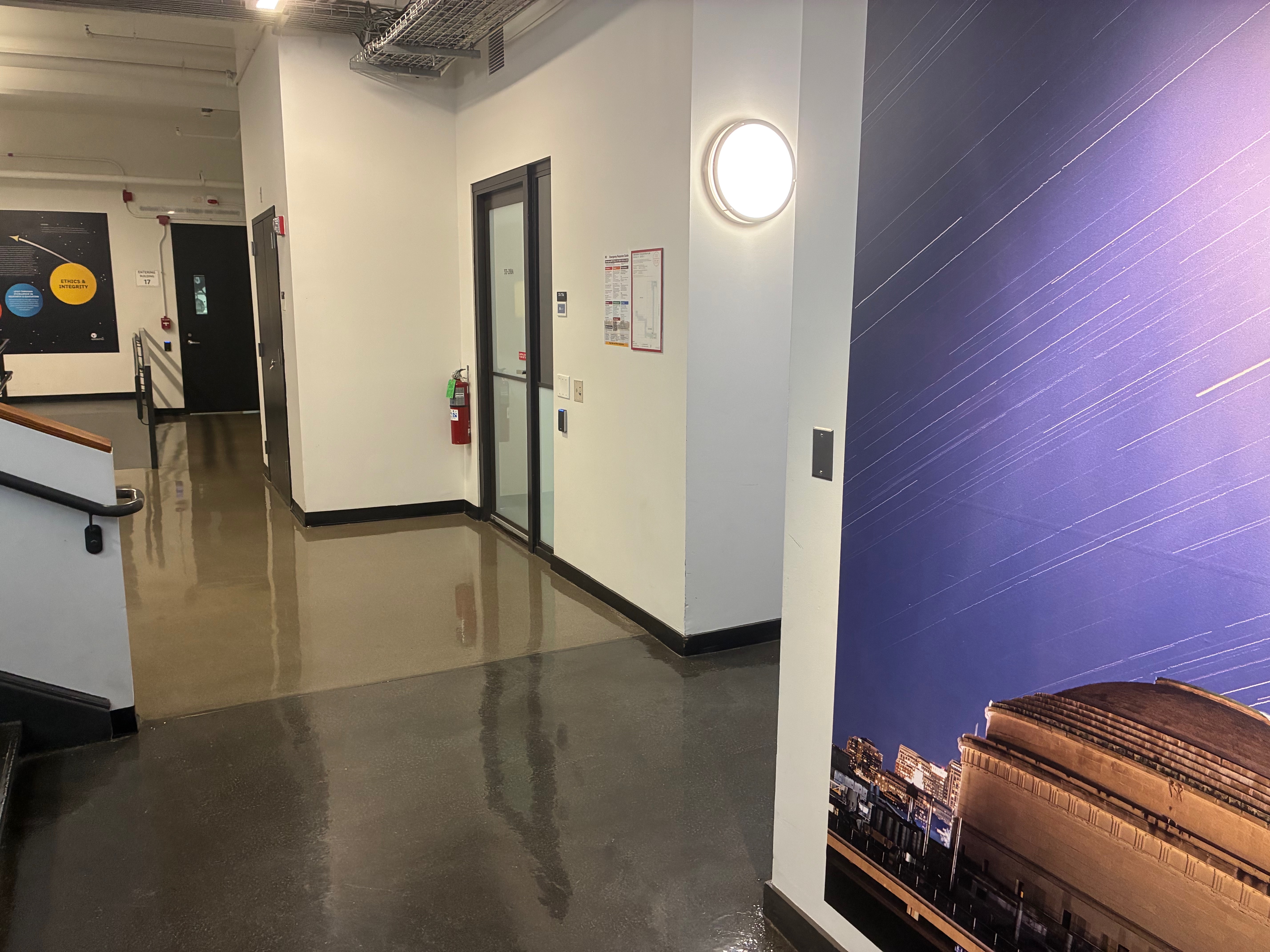 Corridor with a large astrophotograph on the wall